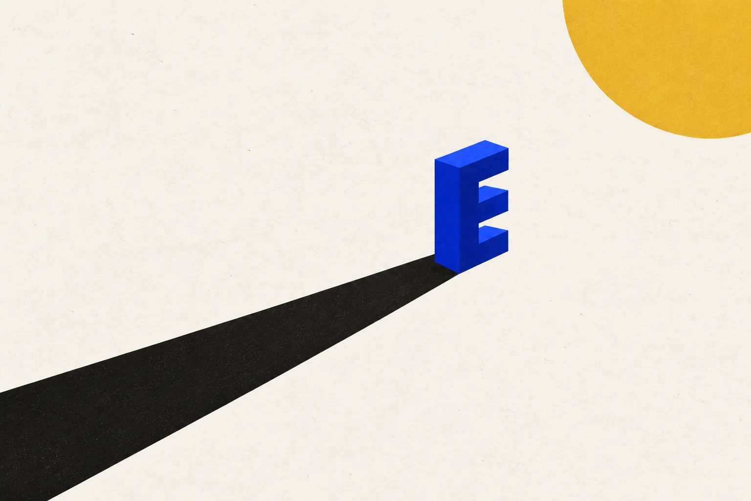A cobalt E sculpture casting one long shadow under the light.